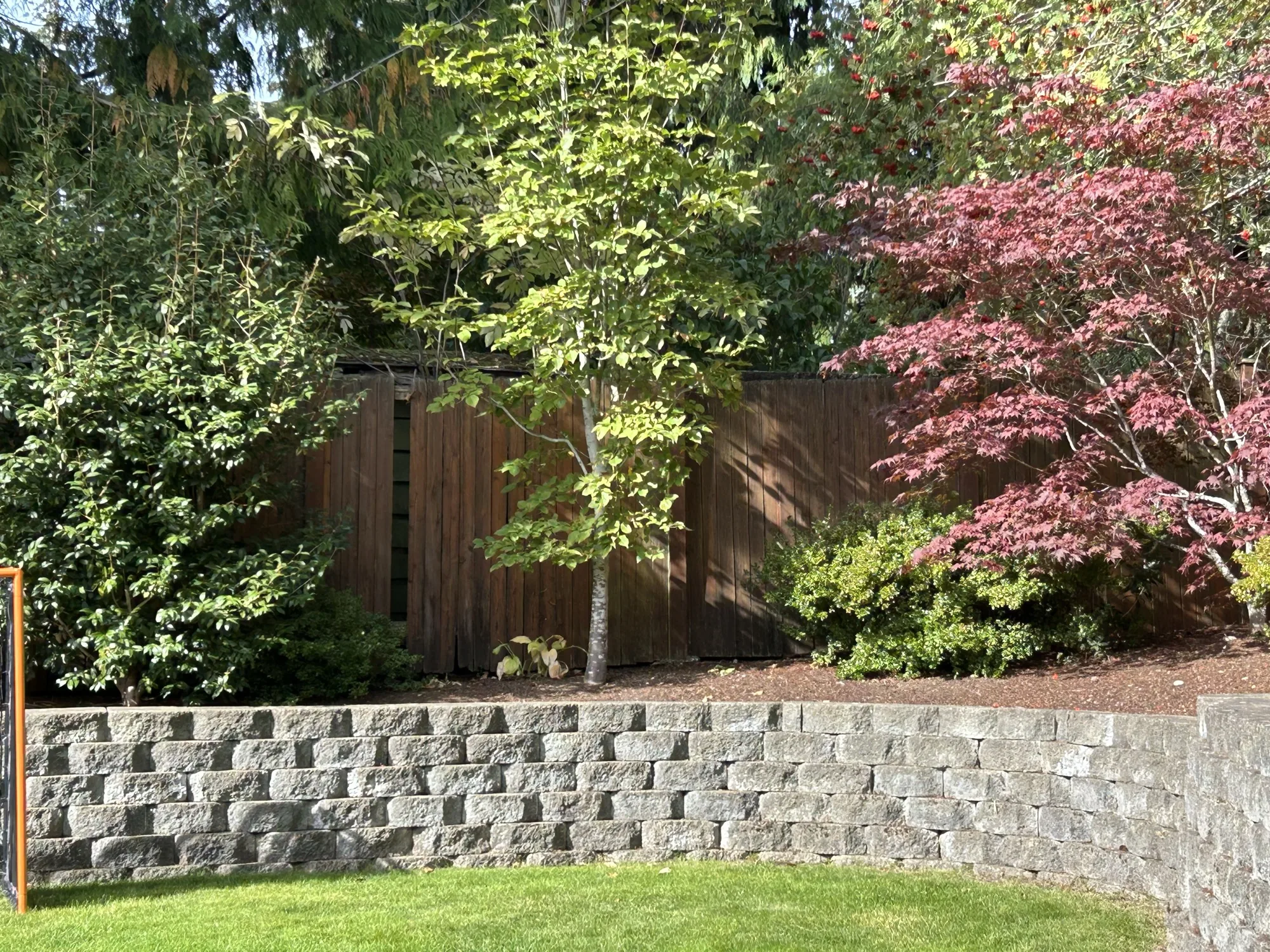 Detailed corner view of completed deck and fence