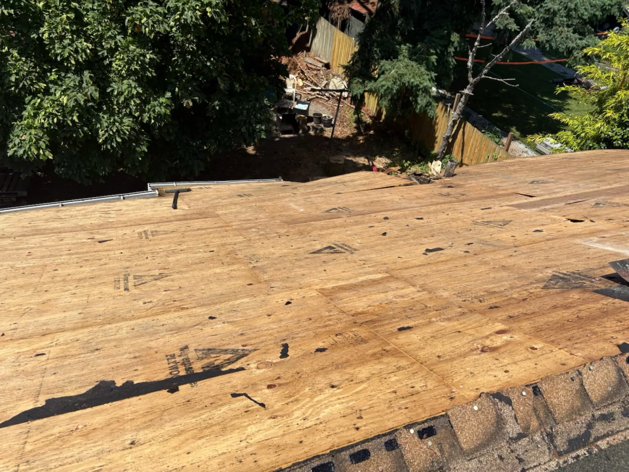 Existing deck showing visible rot at joists and band